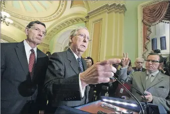  ?? [J. SCOTT APPLEWHITE/THE ASSOCIATED PRESS] ?? Senate Majority Leader Mitch McConnell, R- Ky., joined by Sen. John Barrasso, R-Wyo., speaks with reporters at the Capitol on Tuesday about the House GOP’s plan to replace Obamacare. McConnell said the bill will be opened to amendments in the Senate.