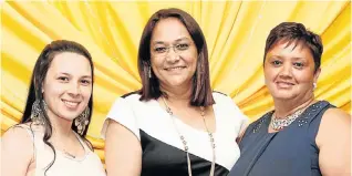  ??  ?? FOOTBALL FANATICS: Fans, from left, Kelly-Ann Agnew, Nawal Fredericks and Michelle Jansen celebrate with their favourite team at the 80th anniversar­y of Swallows Football Club held at the Gelvandale Stadium