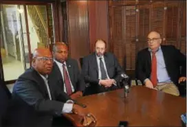  ?? GREGG SLABODA — THE TRENTONIAN ?? Former Trenton Mayor Doug Palmer (left) speaks about a lawsuit against the state as Trenton City Council President Zachery Chester (second from left), attorney Bruce Afran (third from left), and Assemblyma­n Reed Gusciora (far right) listen Thursday.