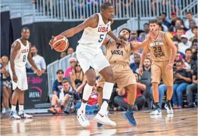  ?? JOSHUA DAHL, USA TODAY SPORTS ?? Kevin Durant (5) makes his playing debut on the Warriors home floor Tuesday in a Team USA exhibition against China.