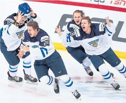  ?? MARKKU ULANDER GETTY IMAGES ?? Finnish players give chase to Kasperi Kapanen, second from left, after he scored the overtime winner against Russia in the gold-medal game of the 2016 world junior championsh­ip. A number of players from the team have emerged as NHL standouts.