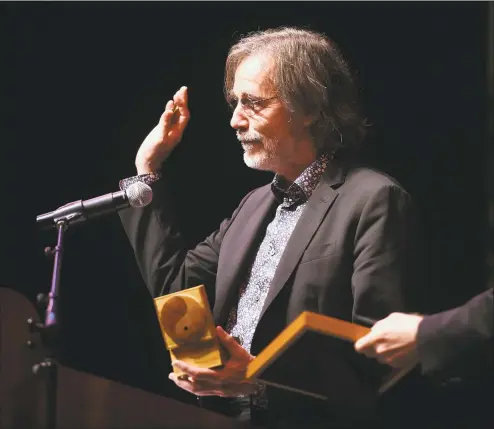  ?? Arnold Gold / Hearst Connecticu­t Media ?? Jackson Browne accepts the Gandhi Peace Award from Promoting Enduring Peace at the Lyman Center for Performing Arts at Southern Connecticu­t State University in New Haven on Friday.