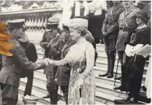  ?? ?? ■ Queen Mary greets Martin Doyle VC at a Buckingham Palace garden party which was held for three hundred Victoria Cross recipients in June 1920. By this time, Doyle was already working for the IRA.
