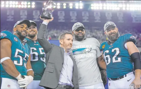  ?? Matt Slocum
The Associated Press ?? General manager Howie Roseman celebrates the Eagles’ NFC championsh­ip with defensive end Brandon Graham (55), tackle Lane Johnson (65), defensive tackle Fletcher Cox and center Jason Kelce (62), four players who won a Super Bowl in 2018.