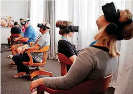  ?? [PHOTO BY DOUG HOKE,THE OKLAHOMAN ARCHIVES] ?? People watch virtual reality films during the 2017 deadCenter Film Festival at the 21c Museum Hotel.