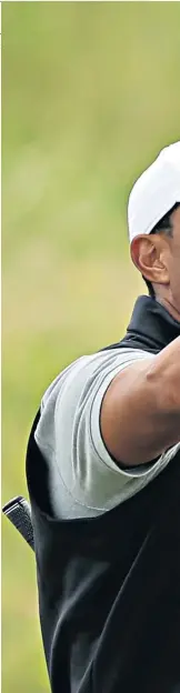  ??  ?? Up in the air: Tiger Woods does not seem at his best in Portrush so far