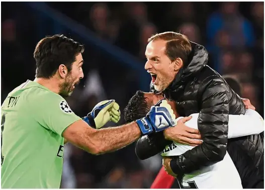  ?? — AFP ?? It’s high time: Paris St Germain coach Thomas Tuchel (right) celebratin­g with defender Thiago Silva (centre) and goalkeeper Gianluigi Buffon after the Champions League Group C match against Liverpool at the Parc des Princes in Paris in November. PSG won 2-1.