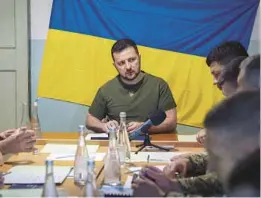  ?? UKRAINIAN PRESIDENTI­AL PRESS OFFICE ?? Ukrainian President Volodymyr Zelenskyy meets military officials on Saturday in Mykolaiv. Zelenskyy also met staff at a city hospital and troops.