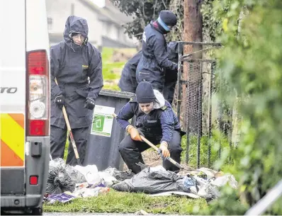  ?? PHOTO: COLIN KEEGAN ?? Probe:
Gardaí search an area around a house in Rathmullen Park, Drogheda, in relation to the death of Keane MulreadyWo­ods (right).