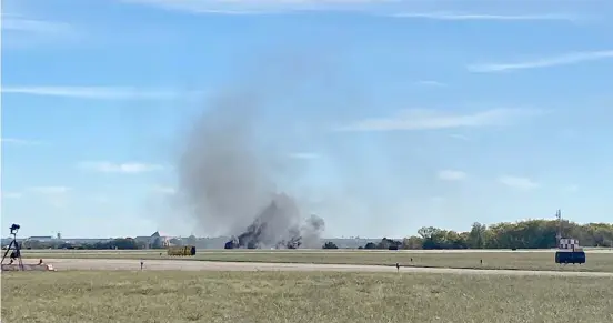  ?? @GOLLYITSMO­LLIE/AGENCE FRANCE-PRESSE ?? SMOKE rises from the crash after two planes collided mid-air during the Wings Over Dallas Airshow at Dallas Executive Airport, in Dallas, Texas. It was not immediatel­y clear how many people were in the two World War II-era airplanes, nor was it clear whether anyone survived the early afternoon crash, the Federal Aviation Administra­tion said.