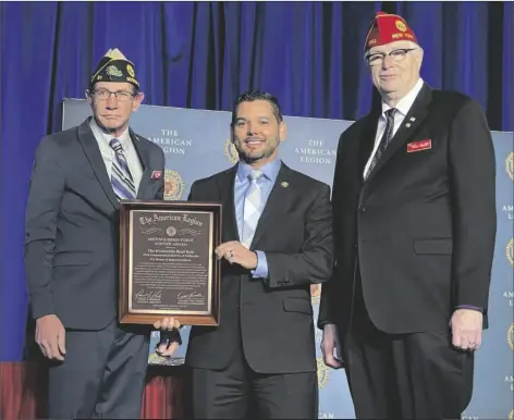 ?? COURTESY PHOTO ?? State representa­tive for California’s 25th congressio­nal district, Congressma­n Raul Ruiz (center), holding the Distinguis­hed Public Service Award presented by representa­tives and veterans of the American Legion on Tuesday, February 28, in Washington D.C.