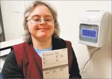  ?? Contribute­d photo ?? Natasha Cole, of Torrington, used a time clock for the first time at her job at Wisdom House in Litchfield.