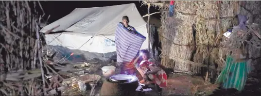  ?? Photo: Nampa/AFP ?? Displaced… Ethiopian refugees who fled the Tigray conflict gather in front of a tent during the Coptic Christmas celebratio­ns at a village next to Um Raquba refugee camp in Gedaref, eastern Sudan.