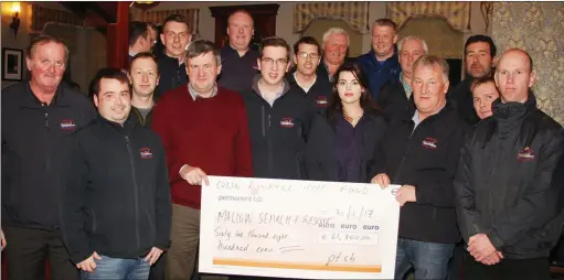  ??  ?? John Joe Ronayne Chairman of the Colin Ronayne fund presenting members of Mallow Search and Rescue with a Cheque of €61,800