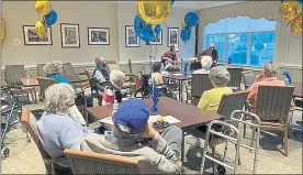  ?? COURTESY OF THE HICKMAN FRIENDS SENIOR COMMUNITY ?? Residents at the Hickman Friends Senior Community celebrate its 130-year anniversar­y by listening to some music.