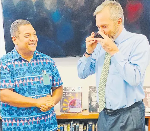  ?? Picture: ABISHEK CHAND ?? Fiji Kava general manager sales George Kotobalavu with US ambassador to Fiji Joseph Cella at the US embassy in Suva.