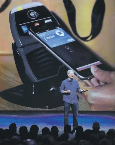  ?? EPA ?? Apple CEO Tim Cook introduces the new Apple Pay system at a launch event at the Flint Centre in California in September, 2014. It was also the site where Steve Jobs first introduced the MacIntosh computer