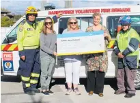  ??  ?? Neville back in May was on hand when fire brigade volunteers presented a cheque to Penny McEwan of Ronald McDonald House.