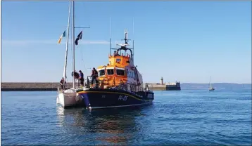  ?? PHOTOBY RNLI ?? Dun Loaghaire RNLI crew rescues a yacht off Bray Head after its engine failed.
