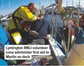  ??  ?? Lymington RNLI volunteer crew administer first aid to Martin on deck