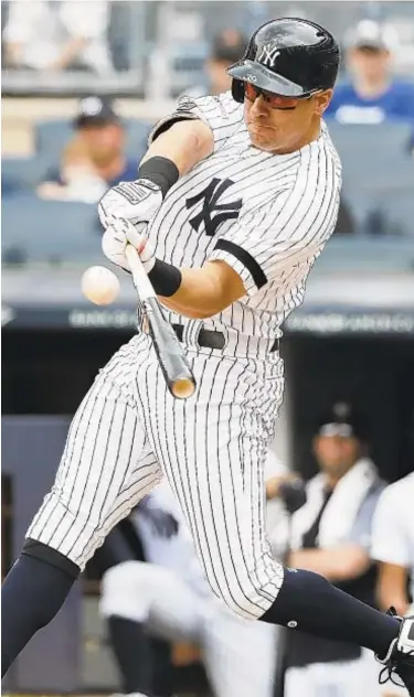  ?? GETTY ?? Mike Tauchman blasts a two-run homer during the second inning on Wednesday in Bronx.