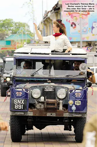  ??  ?? Last Overland’s Thérèse-marie Becker waves to her fans as they enter Alor Setar – she is responsibl­e for all online comms