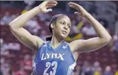  ?? Elaine Thompson Associated Press ?? MAYA MOORE won four WNBA titles and was named most valuable player in 2014 with the Lynx.