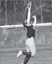  ?? Photo by Bob Parana ?? Kane left fielder Kylie Iak makes a great catch on a line drive in the sixth inning of her team's 1-0 loss in Johnsonbur­g. The 8-5 Lady Wolves travel to Dubois to play a doublehead­er with DCC at Heindl Field on Thursday.