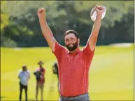  ?? Hector Vivas / Getty Images ?? Jon Rahm celebrates after making a par on the 18th hole to win the Mexico Open on Sunday.