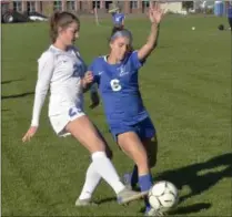  ?? STAN HUDY SHUDY@DIGITALFIR­STMEDIA.COM @STANHUDY ON TWITTER ?? Saratoga Springs senior Madison Tousignant kicks the ball away in front of Shaker’s Maggie O’Rourke in the second half of Friday’s Section 2 Class AA quarterfin­al.