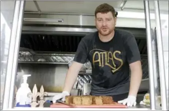  ?? ALAN DIAZ — THE ASSOCIATED PRESS ?? In this photo, chef Ryan Bauhaus poses for a photo at his Atlas Meat-Free Delicatess­en, in Miami. When Bauhaus first started experiment­ing with faux meats, he fixated on recreating that subtle blood taste, settling on a tomato paste blend to mimic the...