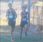  ?? STAFF PHOTO BY TED BLACK ?? Westlake High School junior Jett Hall and Leonardtow­n’s Paul Fagnano race side by side through the narrow straightaw­ay at Westlake on Wednesday. Fagnano edged Hall by less than three-tenths of a second to finish third in the event.