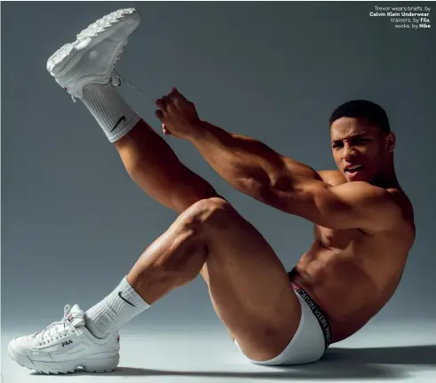  ??  ?? Trevor wears briefs, by Calvin Klein Underwear, trainers, by Fila,
socks, by Nike