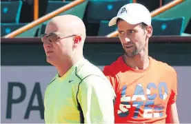  ?? AP ?? Novak Djokovic (right) and Andre Agassi training in Paris.