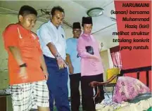  ??  ?? HARUMAINI (kanan) bersama Muhammad
Haziq (kiri) melihat struktur tetulang konkrit
yang runtuh.