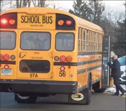  ?? H John Voorhees III / Hearst Connecticu­t Media ?? A school bus arrives at a school in Danbury this month.