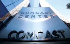  ?? ASSOCIATED PRESS FILE PHOTO ?? A sign is seen outside the Comcast Center in Philadelph­ia. Comcast is trying to refigure the traditiona­l cable bundle, adding services like Netflix to its subscripti­on packages and offering internet-only TV streaming. The moves come as Comcast and...