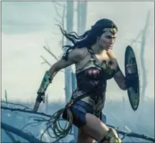  ?? ASSOCIATED PRESS ?? This image released by Warner Bros. Entertainm­ent shows Gal Gadot in a scene from “Wonder Woman.”