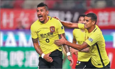  ?? PROVIDED TO CHINA DAILY ?? Paulinho celebrates scoring for Guangzhou Evergrande in Tuesday’s 2-1 AFC Champions League loss to Japan’s Kashima Antlers in Kawasaki that put the Chinese champion into the quarterfin­als.