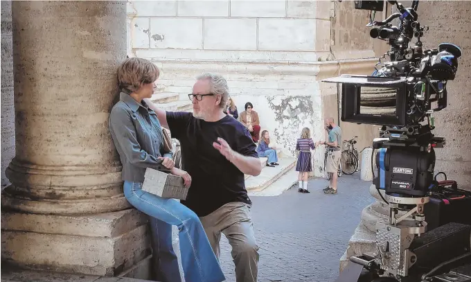  ??  ?? ON A MISSION: Michelle Williams and director Ridley Scott discuss a scene on the set of ‘All the Money in the World.’