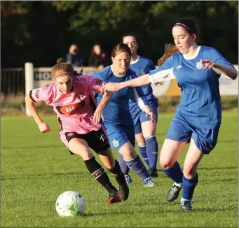  ??  ?? Linda Douglas of Wexford Youths goes past Manolla FC’s Megan Costello at Ferrycarri­g Park.