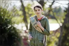  ?? MARK HUMPHREY — THE ASSOCIATED PRESS ?? Olivia Chaffin, 14, stands for a portrait with her Girl Scout sash in Jonesborou­gh, Tenn., on Sunday, Nov. 1, 2020.