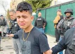  ?? ?? The 15-year-old boy who shot a tourist and opened fire on a cop in Times Square — then bawled when he was arrested — is facing two counts of attempted murder, police said Saturday.
