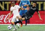  ?? CURTIS COMPTON / CCOMPTON@AJC.COM ?? Atlanta United hopes to get midfielder Darlington Nagbe (left) back in time for the run up to the playoffs in October.