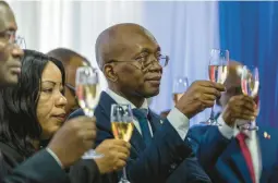  ?? RAMON ESPINOSA/AP ?? Haiti’s interim Prime Minister Michel Patrick Boisvert makes a toast Thursday at the swearingin ceremony of the transition­al council in Port-au-Prince.