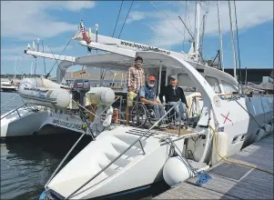  ?? COLIN MACLEAN/JOURNAL PIONEER ?? Captain Will Rey stands with Bob Vogel and Allen Fiske aboard the Impossible Dream. Fiske and Vogel are passengers aboard the vessel, which was designed for people in wheelchair­s.