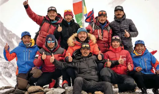  ??  ?? The combined all-nepali teams return from its historic summit battered but not broken, led by Mingma G (center) and Nirmal Purja (second from bottom left).