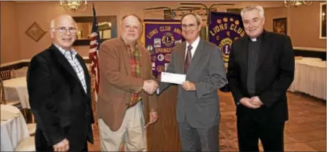  ??  ?? During a recent dinner meeting, the Springfiel­d Lions welcomed The Rev. Wylie Johnson, pastor of Springfiel­d Baptist Church; the Rev. Robert Kinzei, pastor of the Blue Church; and the Rev. David Beresford, rector of Church of the Redeemer; and members...