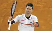  ?? ALESSANDRA TARANTINO AP ?? Novak Djokovic celebrates winning a quarterfin­al match against Pablo Carreno Busta in four sets on Wednesday.