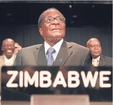  ??  ?? END OF ERA: Faced with impeachmen­t, Robert Mugabe yesterday resigned as president of Zimbabwe